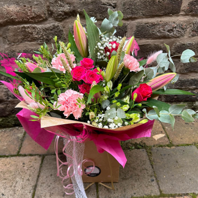 Blushing Meadow - A stunning collection of pink and green seasonal flowers in toning packaging. This bouquet is designed to impress and uplift any space. Blushing Meadow - A stunning collection of pink and green seasonal flowers in toning packaging. This bouquet is designed to impress and uplift any space.