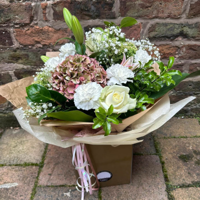 Evelyn - A fabulous collection of white and cream flowers make this the perfect gift. This bouquet will be hand delivered by the local florist. Evelyn - A fabulous collection of white and cream flowers make this the perfect gift. This bouquet will be hand delivered by the local florist.
