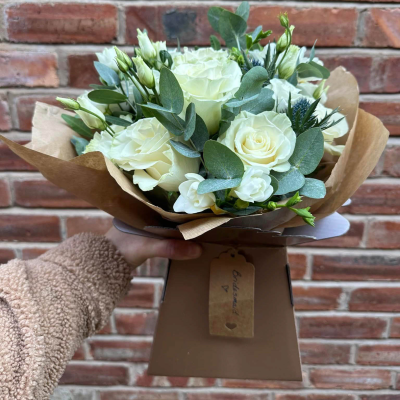 Classic Harmony - Share your sentiments with this beautiful arrangement of white and green blooms complemented by lush greenery. Presented in elegant wrapping. Classic Harmony - Share your sentiments with this beautiful arrangement of white and green blooms complemented by lush greenery. Presented in elegant wrapping.